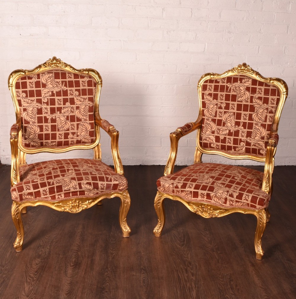 pair of gilt wood arm chairs 