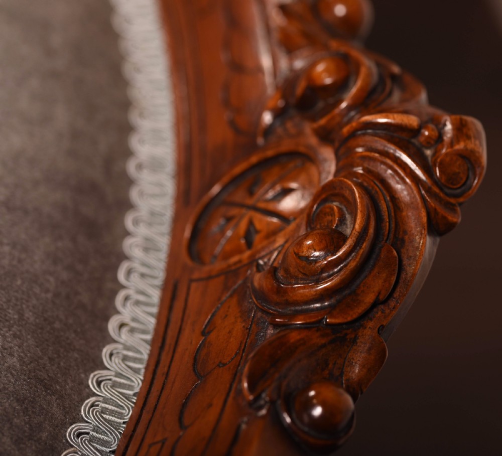 A matching pair of Walnut Victorian ladies and gents chairs View X