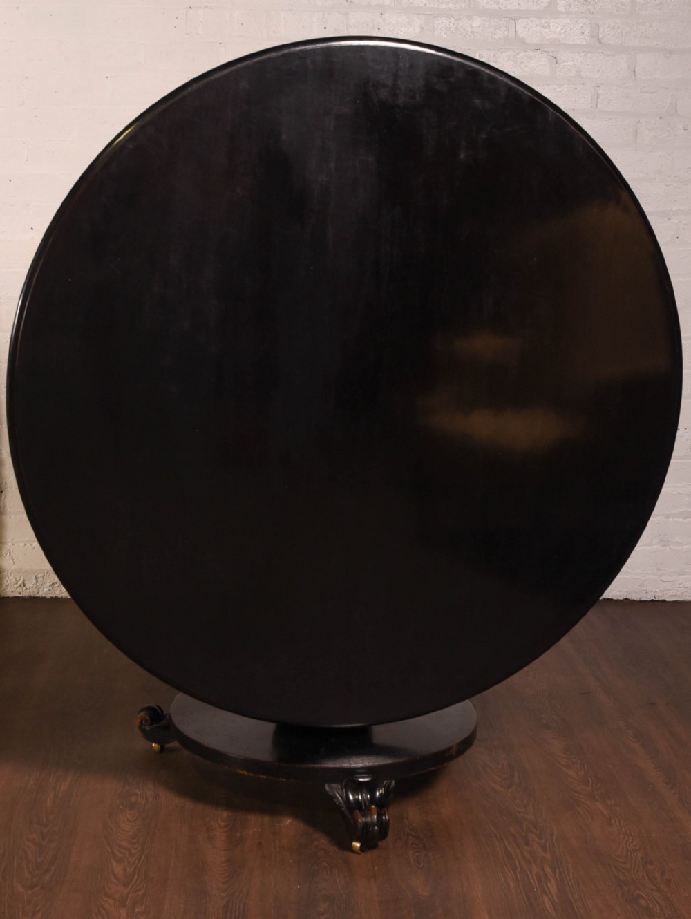 Victorian round ebonised snap top dining table 