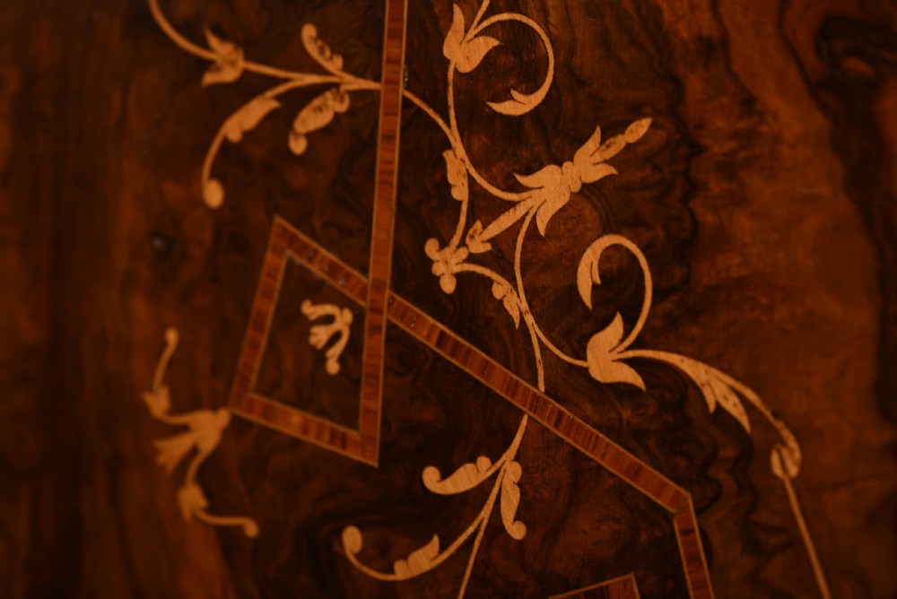 Stunning Figured walnut inlaid oval snap top loo table  View II