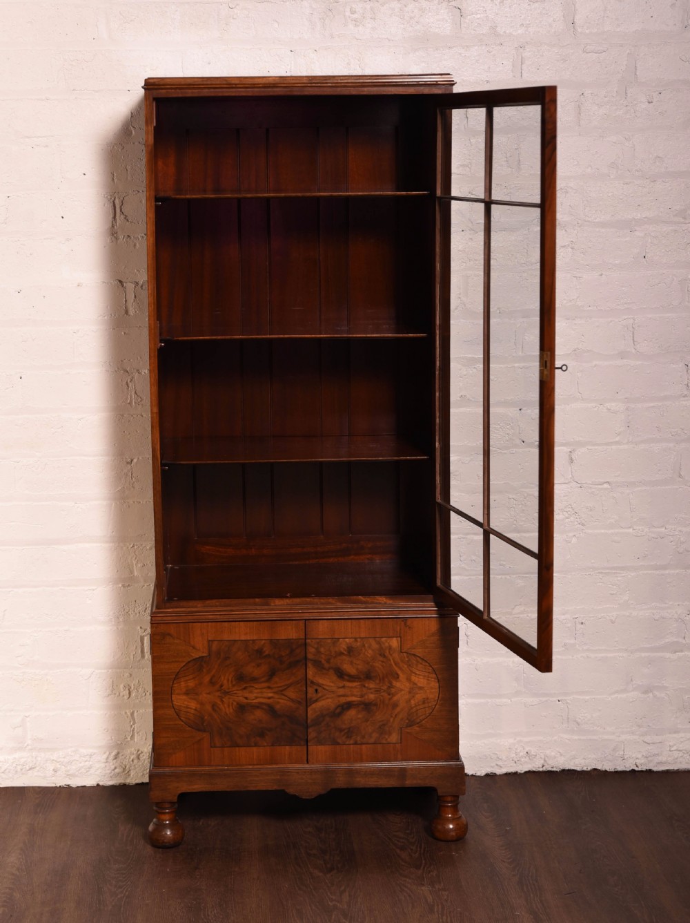 A neat Walnut single door glazed bookcase  View VI