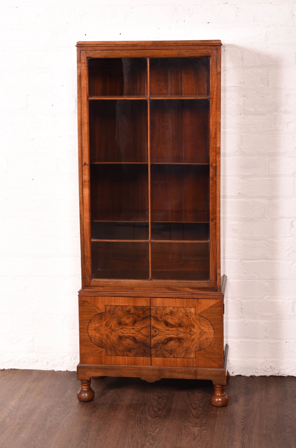 A neat Walnut single door glazed bookcase  View VII