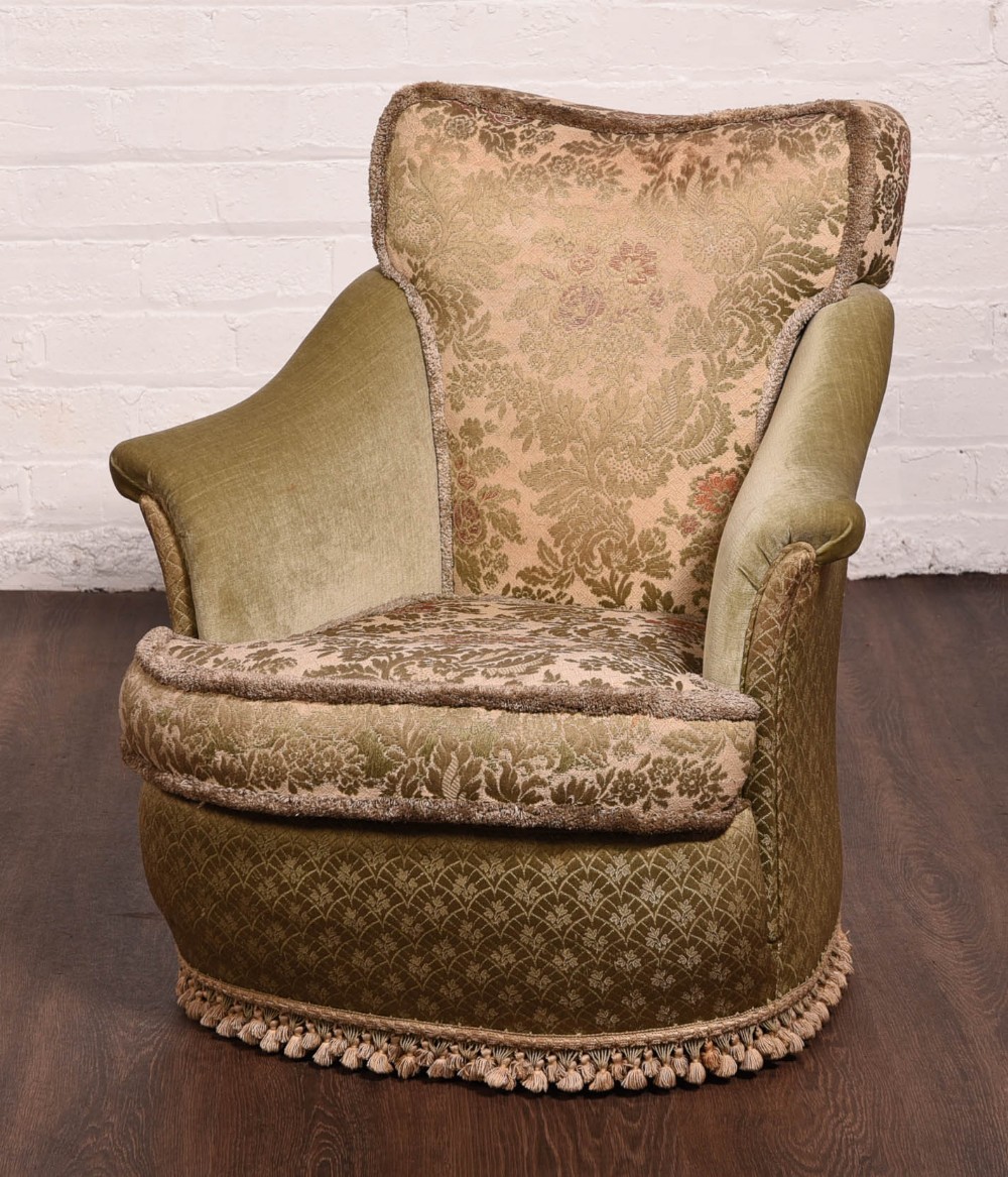 An original upholstered  tub chair 