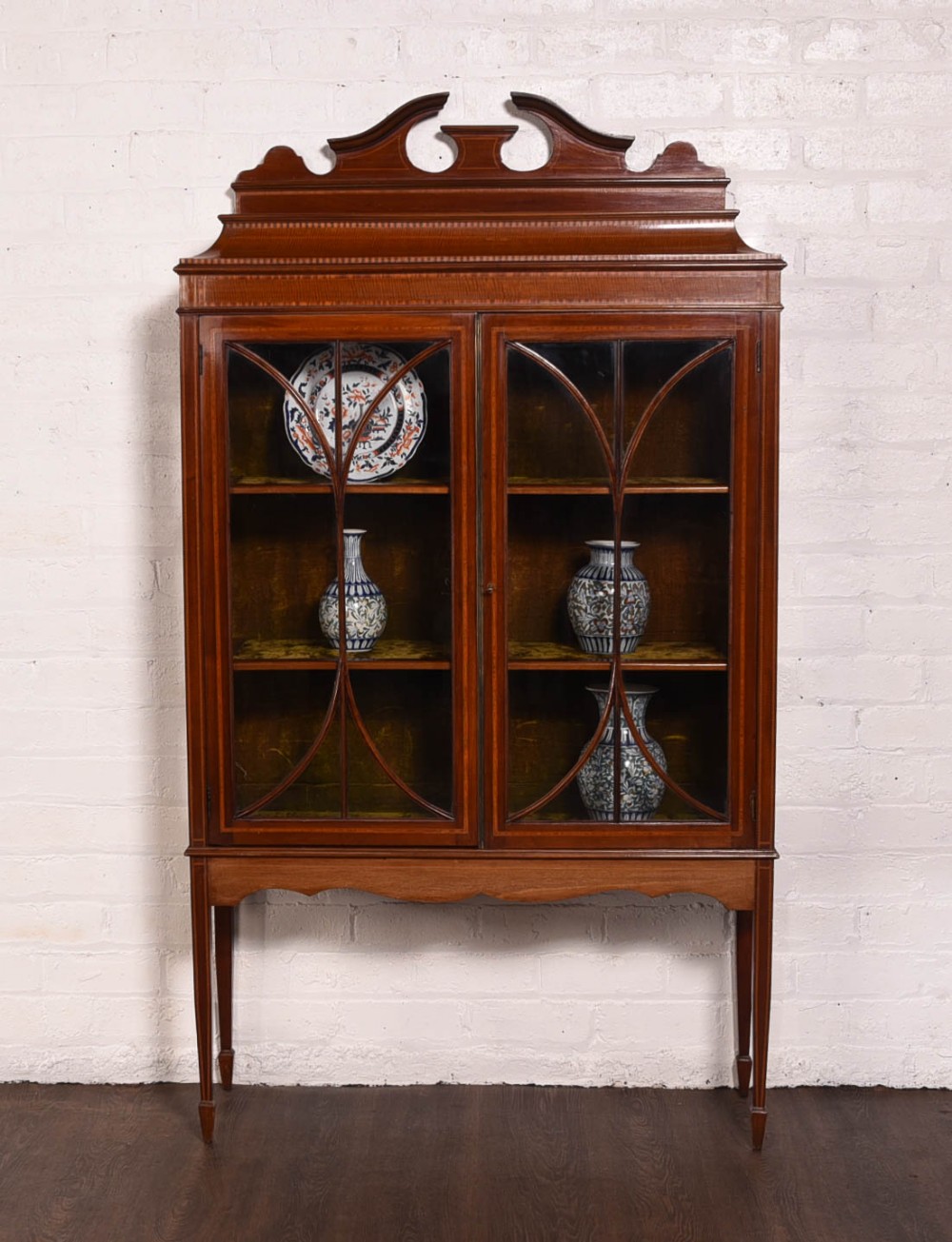 Striking sheraton revival inlaid mahogany display cabinet 