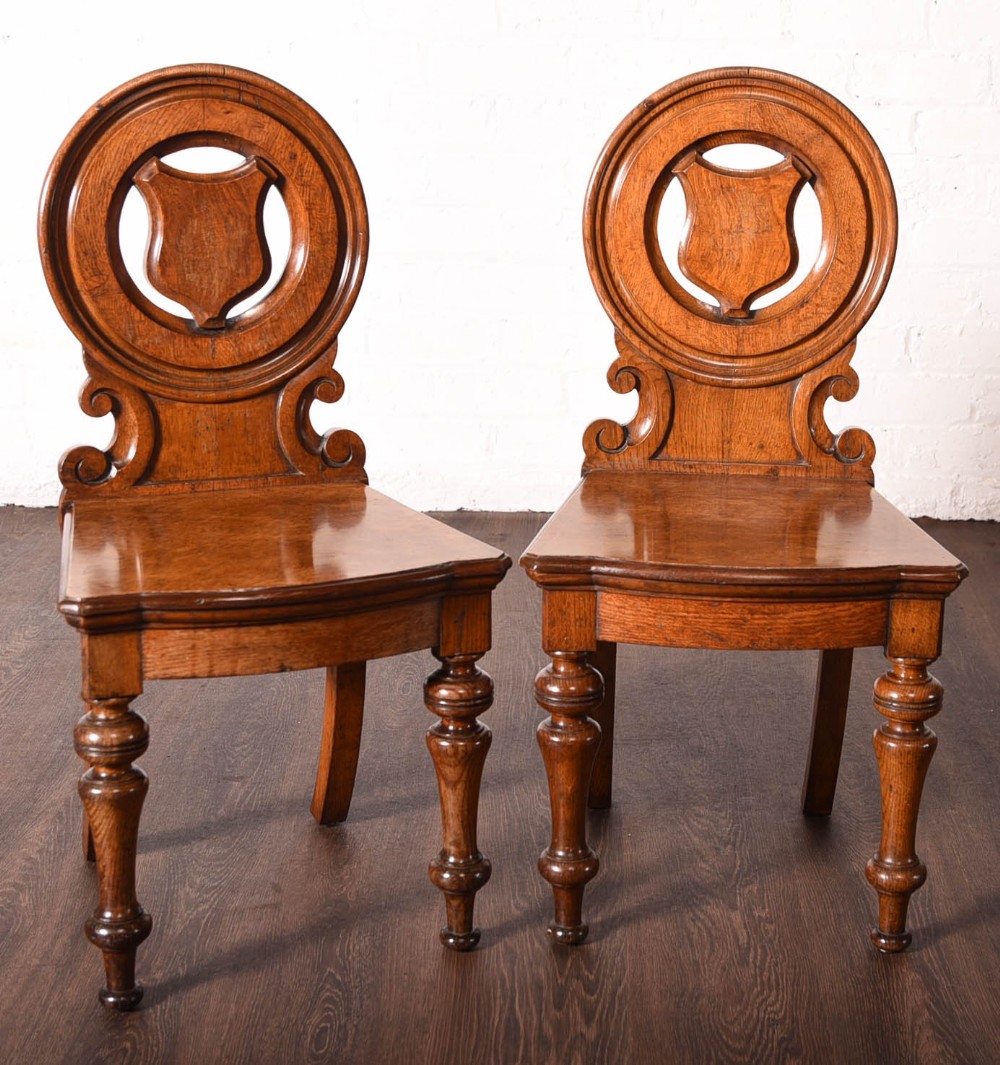 Pair of pollard oak hall chairs by George Ashworth of Leeds 