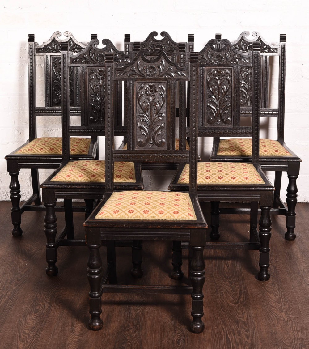 Set of 6 carved dark oak chairs by john Taylor of Edinburgh
