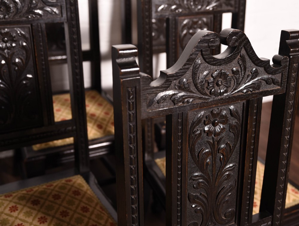 Set of 6 carved dark oak chairs by john Taylor of Edinburgh View II