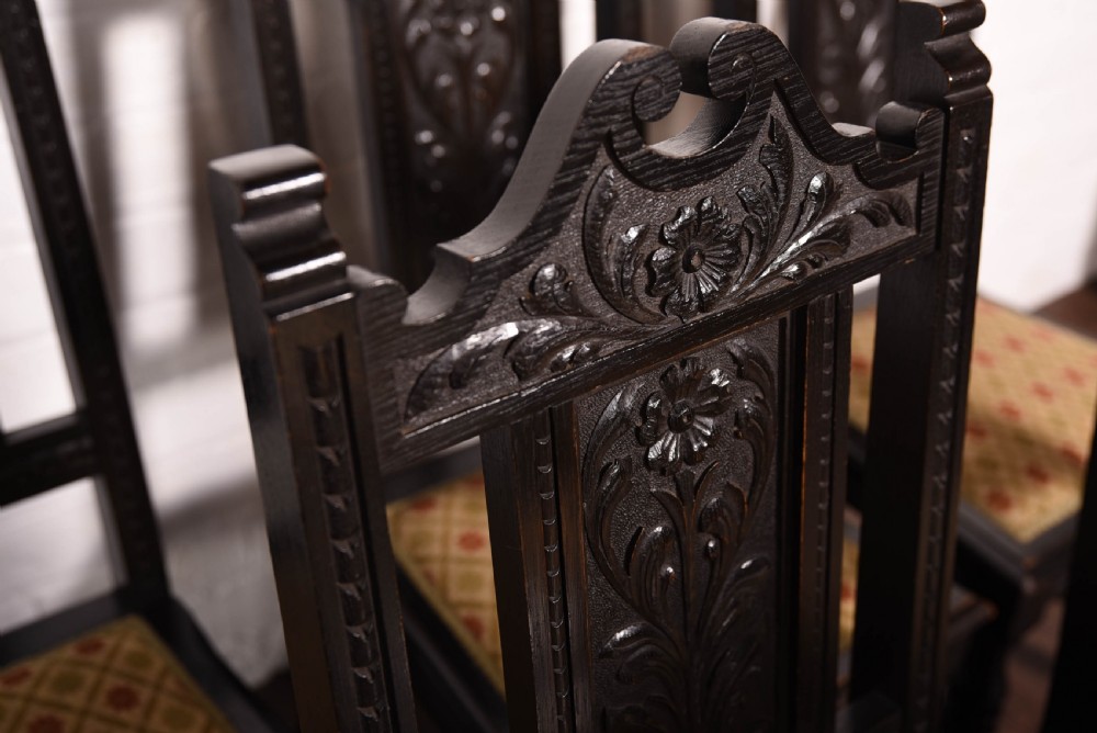 Set of 6 carved dark oak chairs by john Taylor of Edinburgh View IV