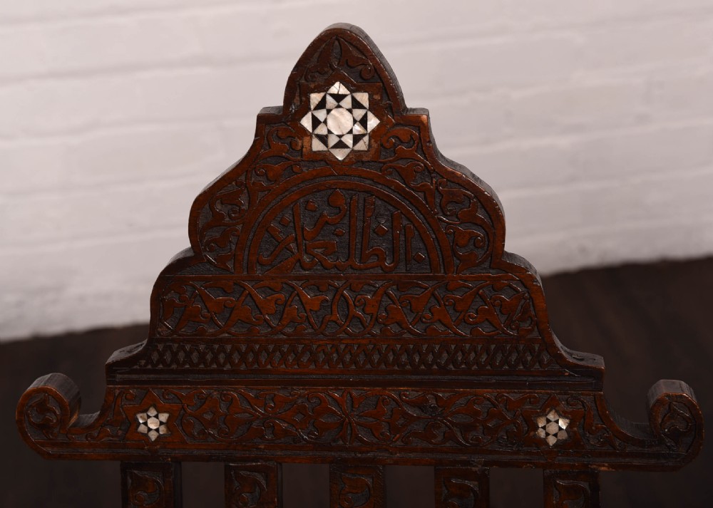 A rare pair late 19th century Islamic carved folding chairs  View XV