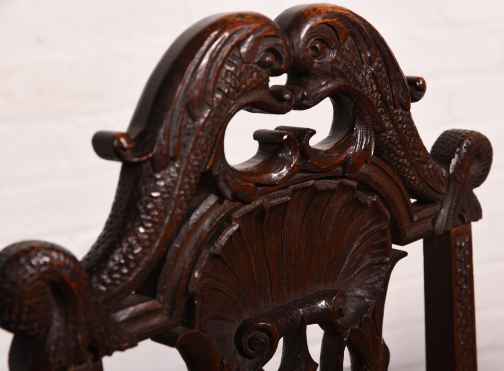 A stunning pair of carved oak arm chairs  View II