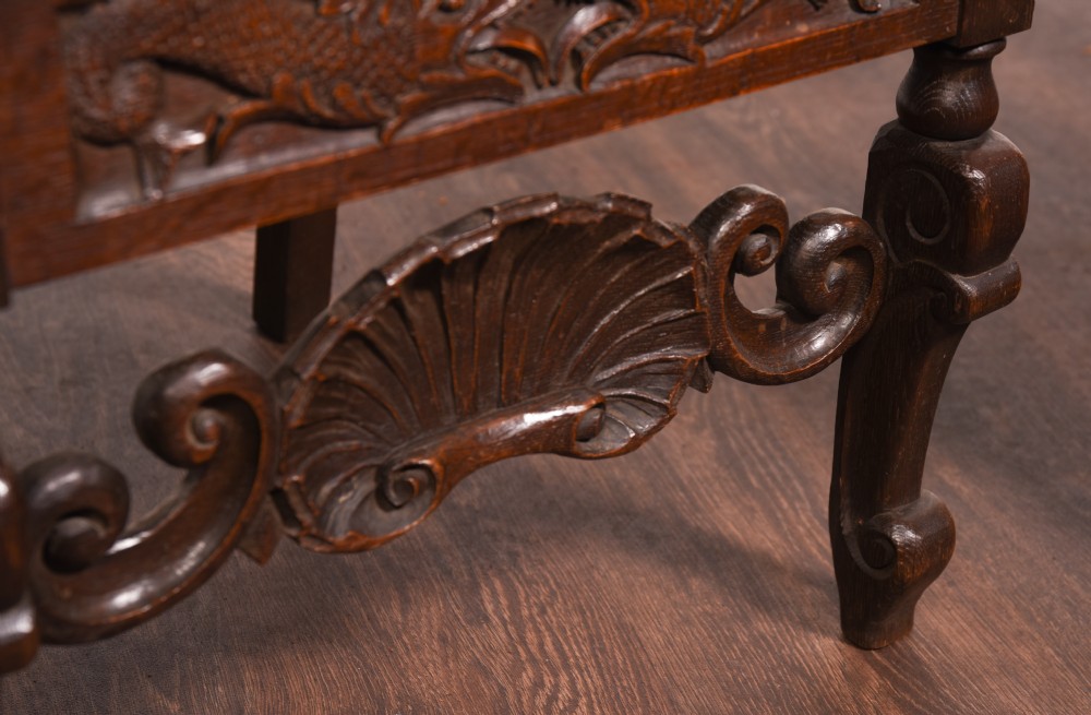 A stunning pair of carved oak arm chairs  View V