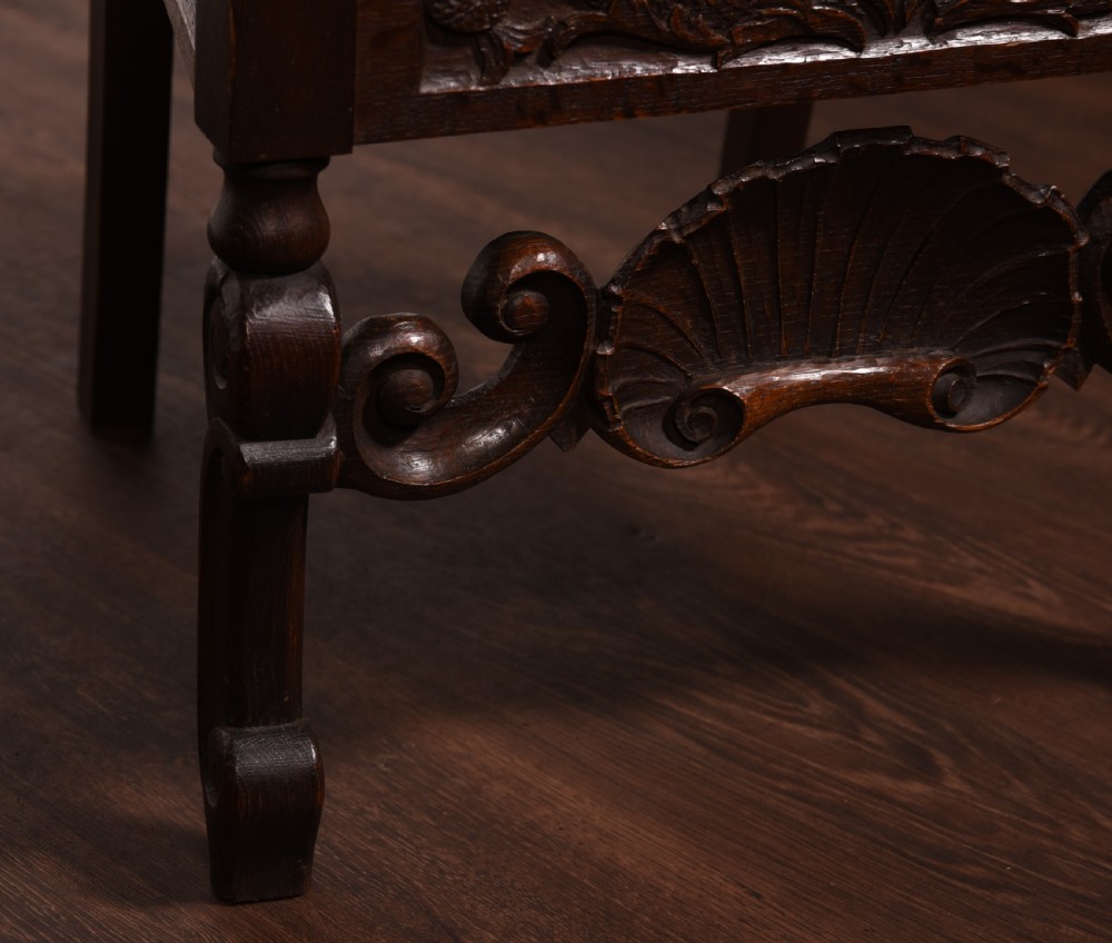 A stunning pair of carved oak arm chairs  View VI