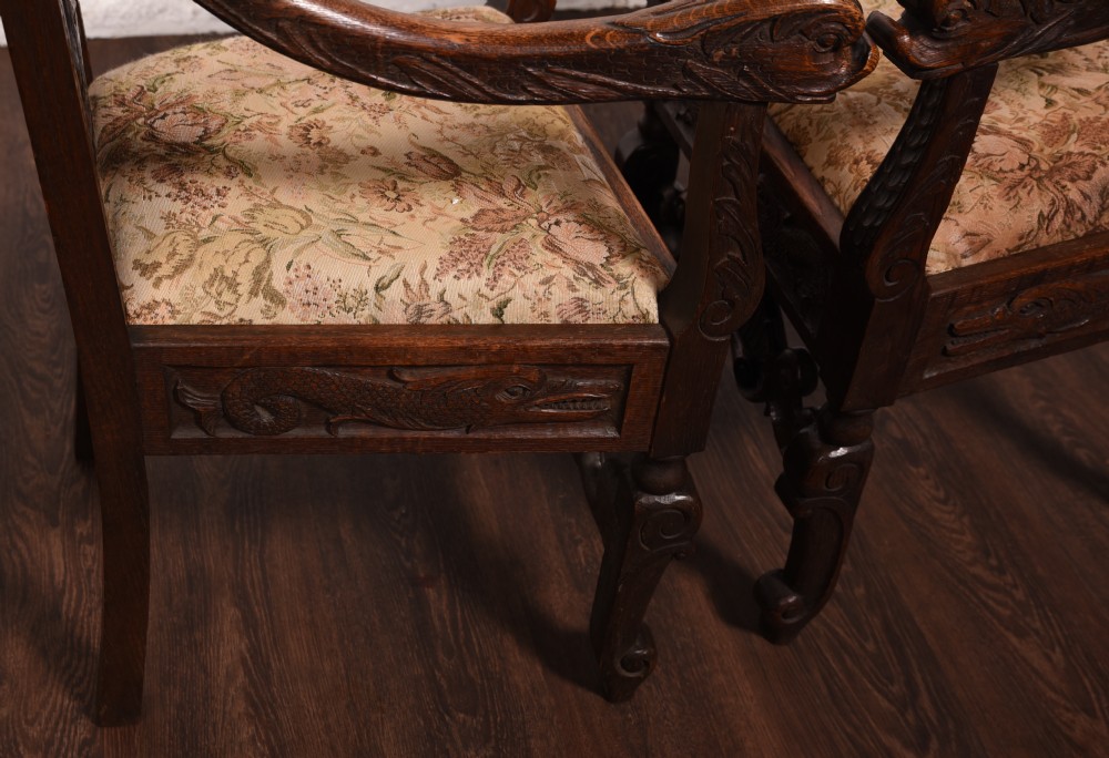 A stunning pair of carved oak arm chairs  View VIII