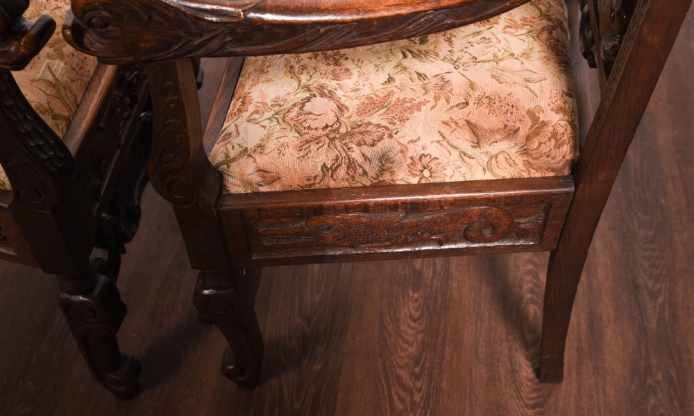 A stunning pair of carved oak arm chairs  View IX