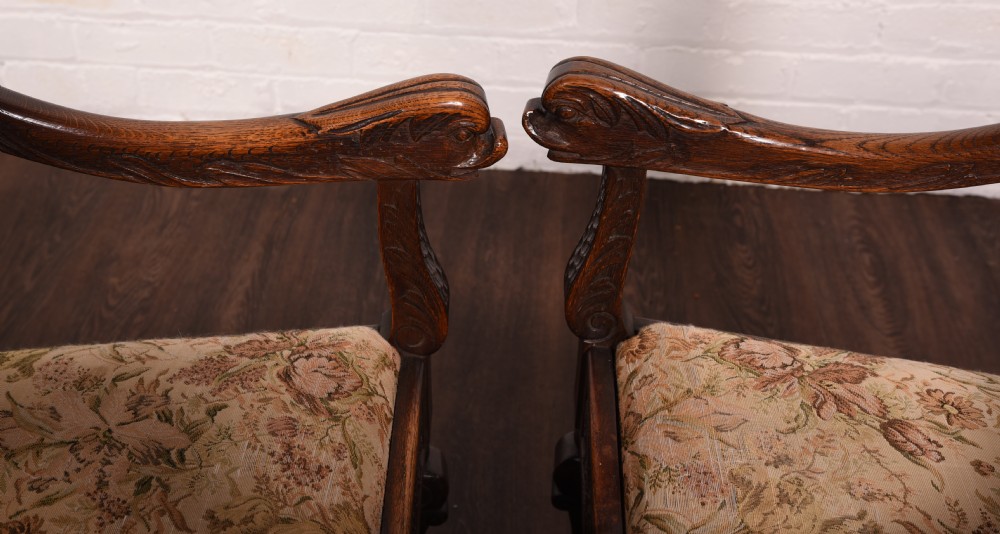 A stunning pair of carved oak arm chairs  View X