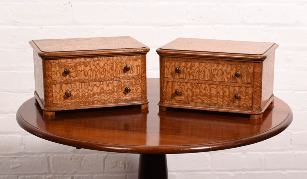 A pair of Victorian miniature chest of drawers made from Hungarian ash 