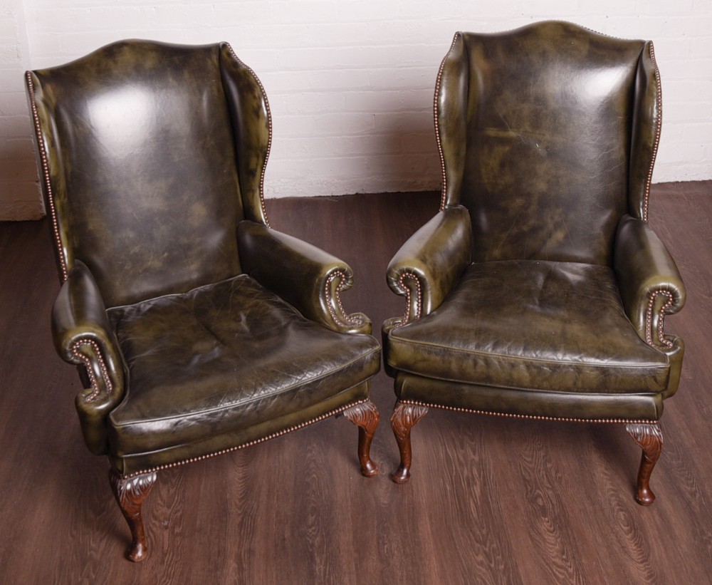 An Elegant pair of hand died leather wing chairs 