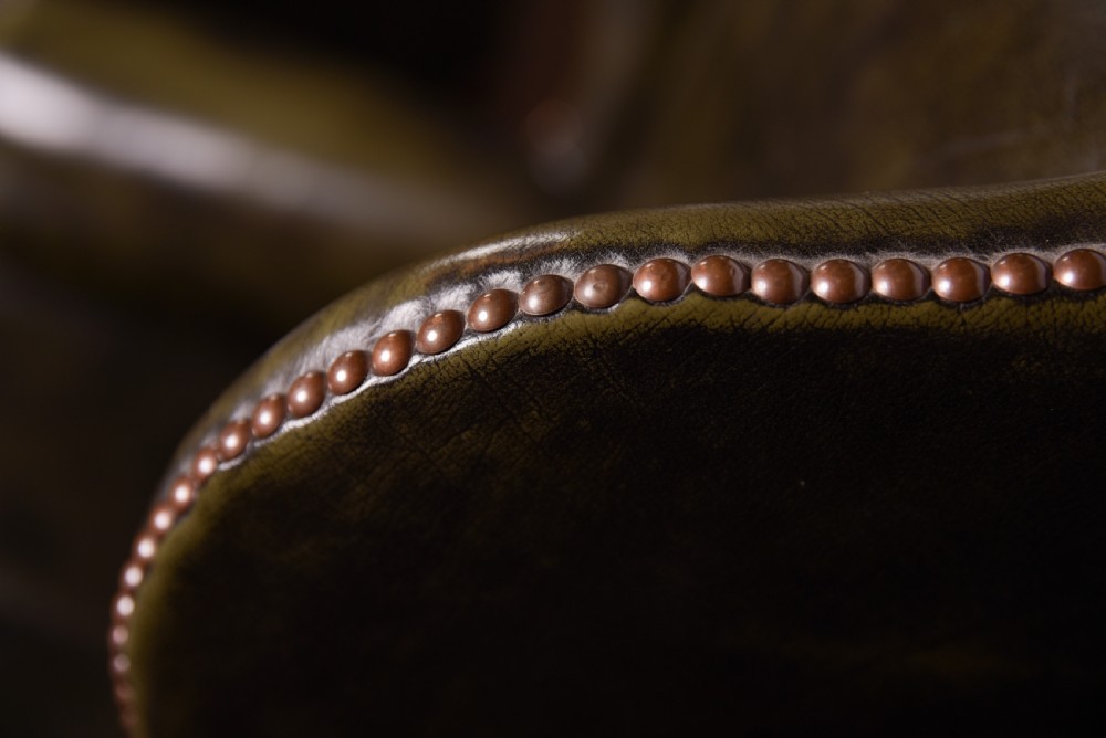 An Elegant pair of hand died leather wing chairs  View V