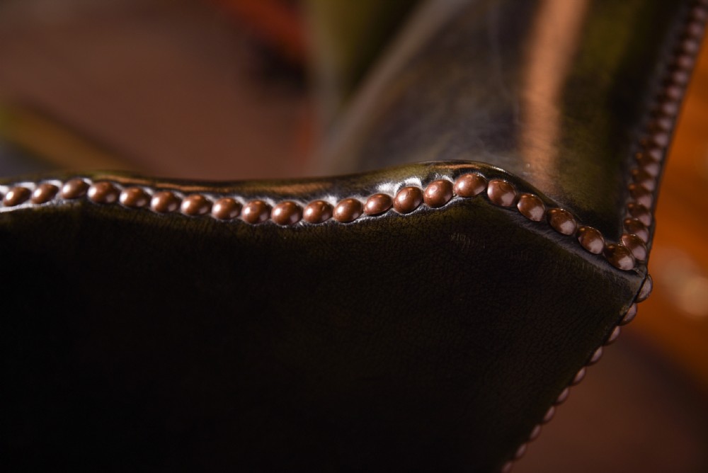 An Elegant pair of hand died leather wing chairs  View VI