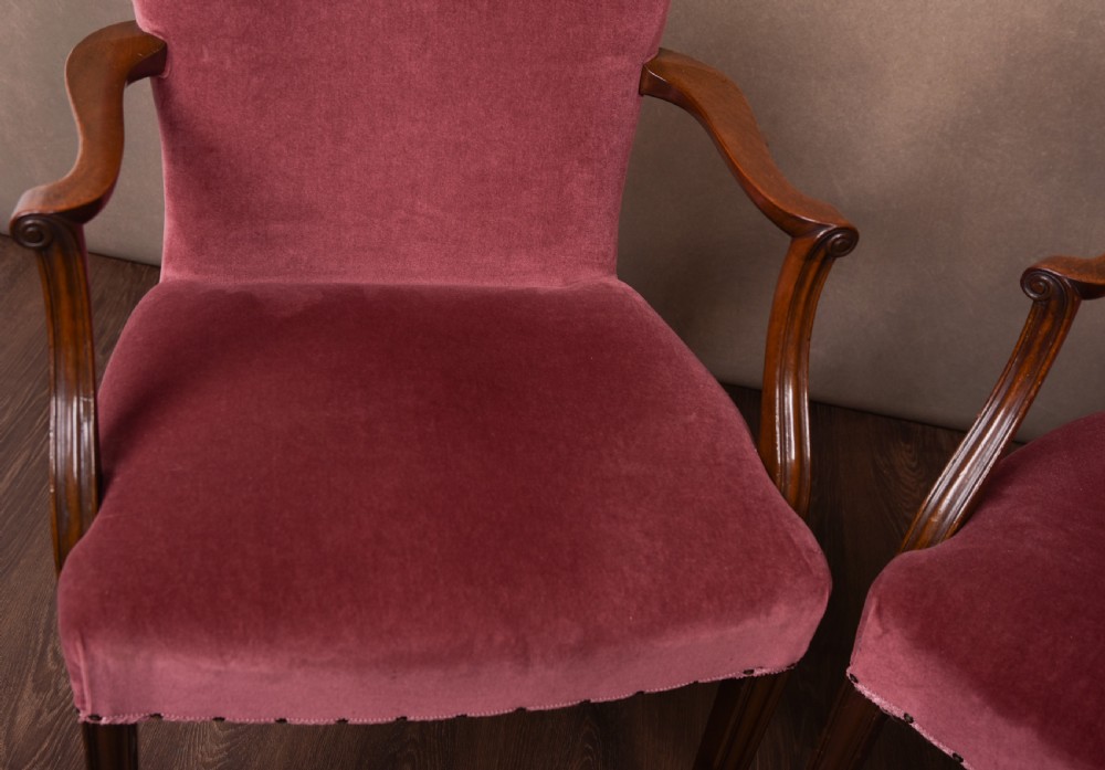 An elegant pair of upholstered elbow desk chairs  View IV