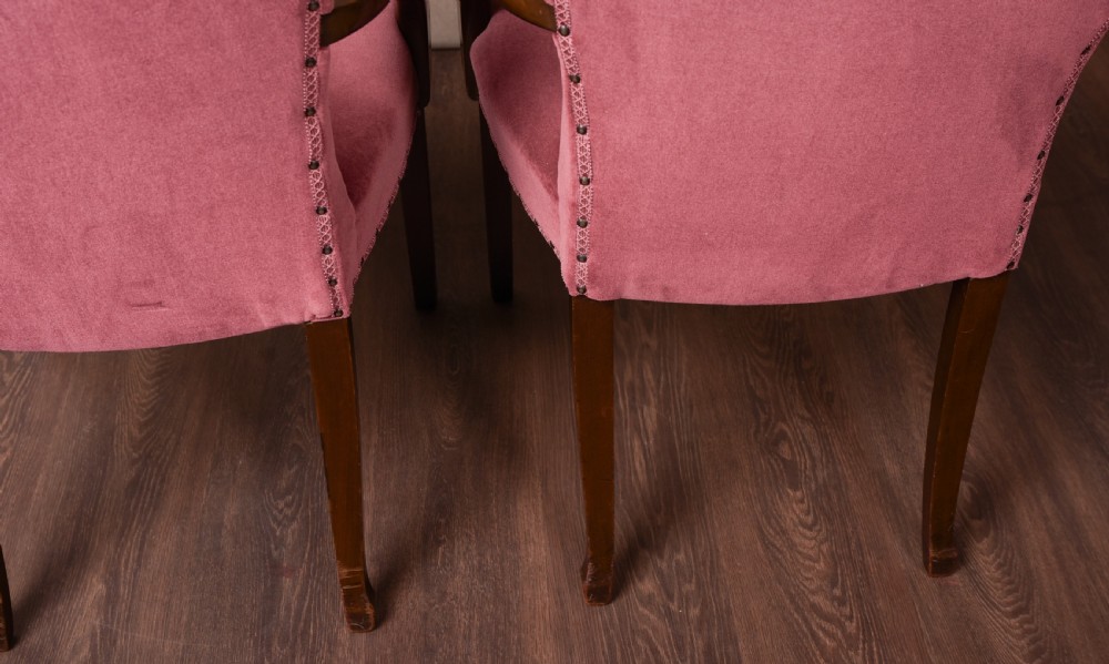 An elegant pair of upholstered elbow desk chairs  View X