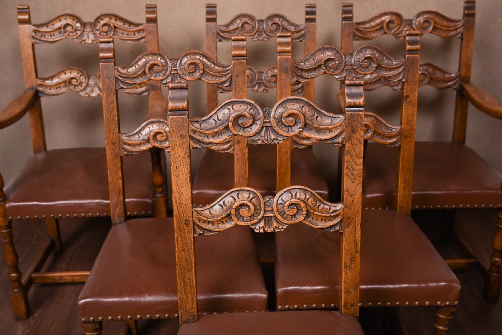 Edwardian carved oak refectory table and 6 chairs  View XXIX