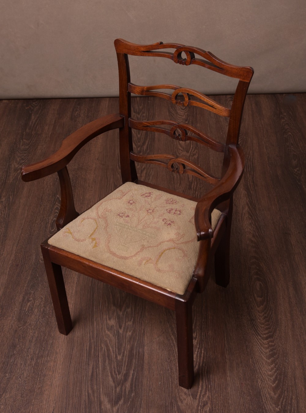 A child's Mahogany Chippendale Style arm chair 