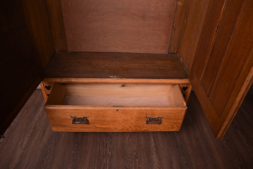 Outstanding oak Arts and crafts Wardrobe attributed to Liberty & Co  View XIV