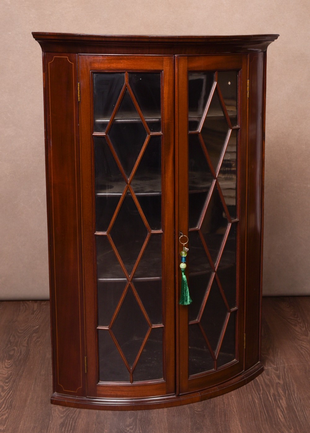19th century Inlaid Mahogany bow fronted hanging corner cabinet 