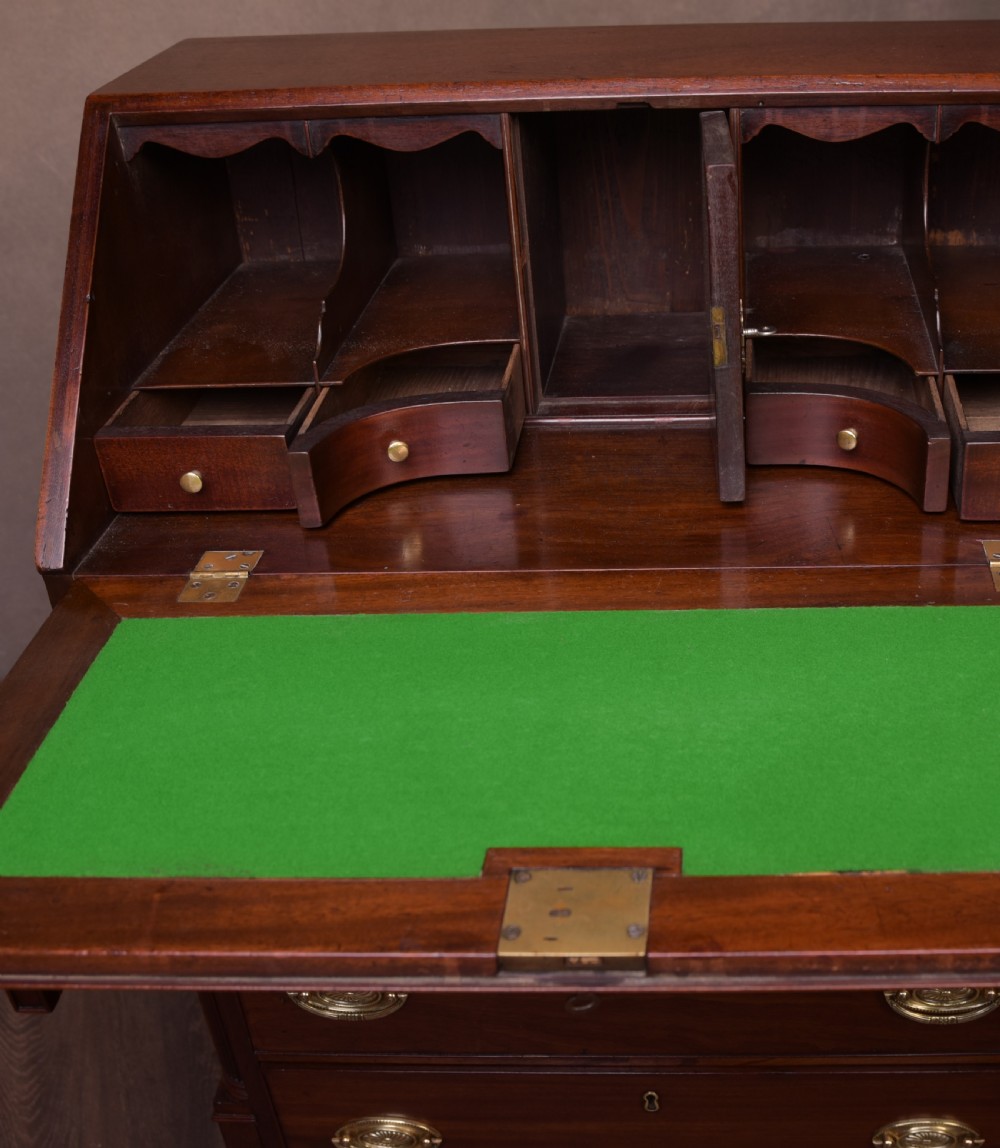 A neat proportioned Georgian Mahogany writing bureau  View IX