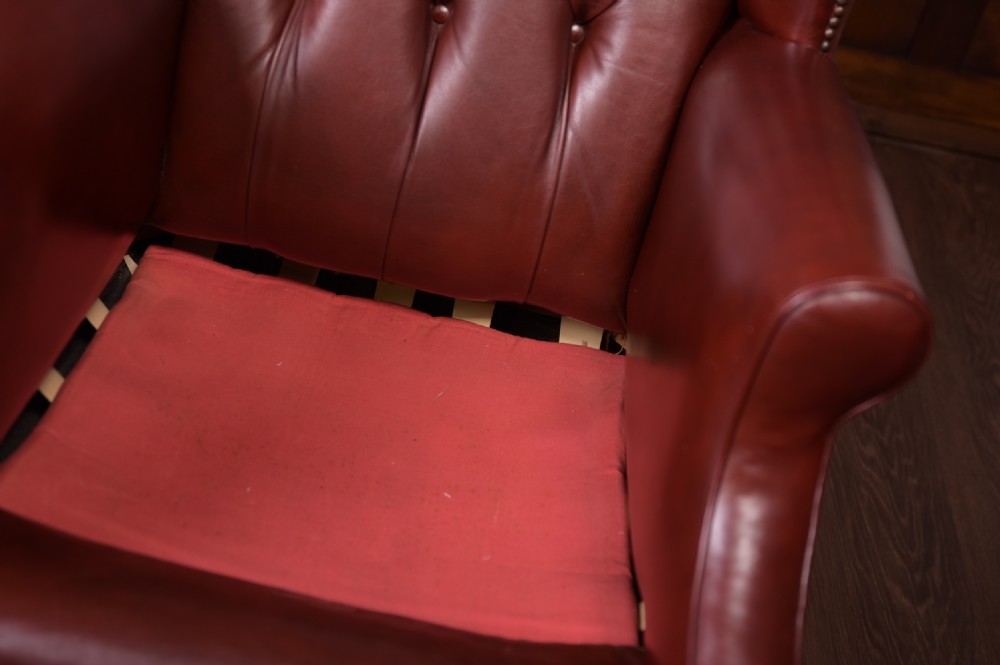 Edwardian Pair of leather Chesterfield wing back chairs  View IV