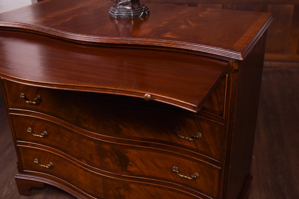 Edwardian Flame Mahogany serpentine 4 drawer chest   View VII