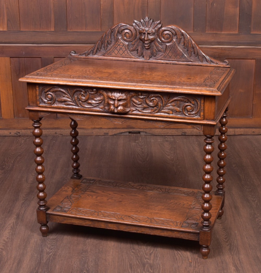 Carved oak green man Hall table