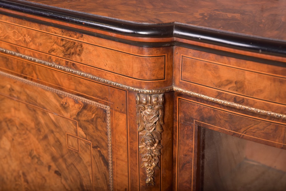 A Victorian burr walnut credenza featuring a central inlaid cupboard door flanked by curved glass display sections with gilt-bronze mounts. View III