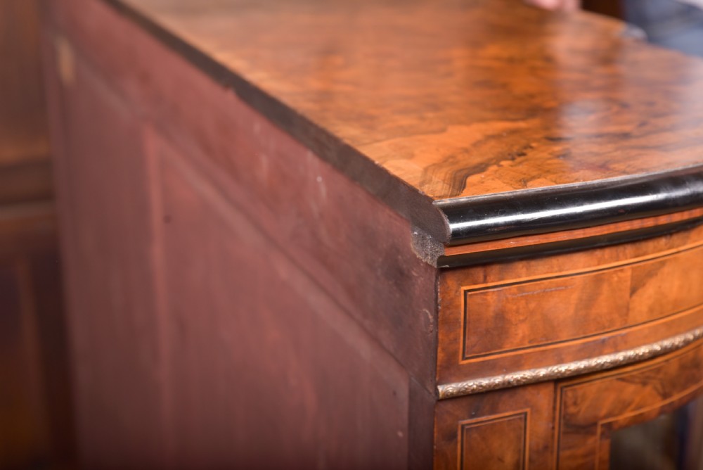 A Victorian burr walnut credenza featuring a central inlaid cupboard door flanked by curved glass display sections with gilt-bronze mounts. View XIV