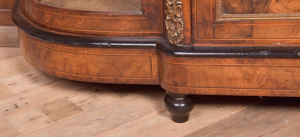 A Victorian burr walnut credenza featuring a central inlaid cupboard door flanked by curved glass display sections with gilt-bronze mounts. View XVI