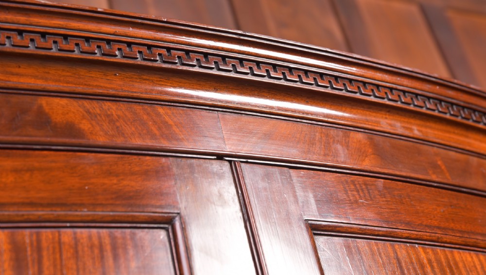 A Neat proportioned Edwardian Mahogany bow fronted wardrobe  View V
