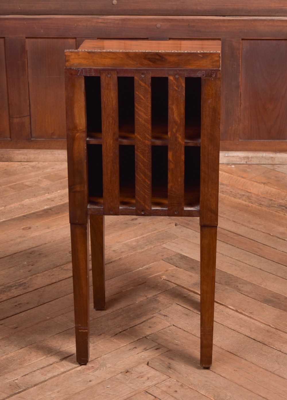 An antique walnut bedside cabinet featuring a single door panel with burr walnut veneer, beaded metal trim, a top splashback upstand, and four square tapered legs. View VIII