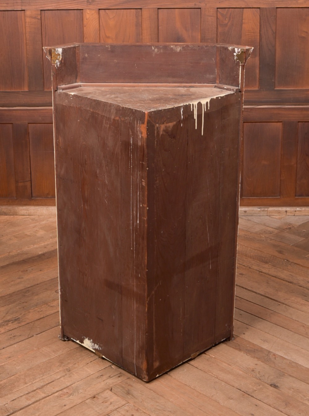 An Edwardian mahogany corner cabinet featuring astragal glazed glass panels, geometric boxwood line inlay, and internal timber shelves. View IX