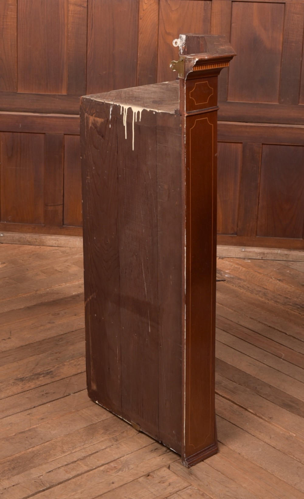 An Edwardian mahogany corner cabinet featuring astragal glazed glass panels, geometric boxwood line inlay, and internal timber shelves. View X