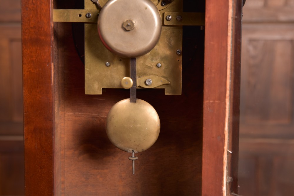 An antique mahogany bracket clock featuring Gothic spire finials, a carved foliage crest, and a cream dial signed Christie Perth set within a brass bezel. View VII