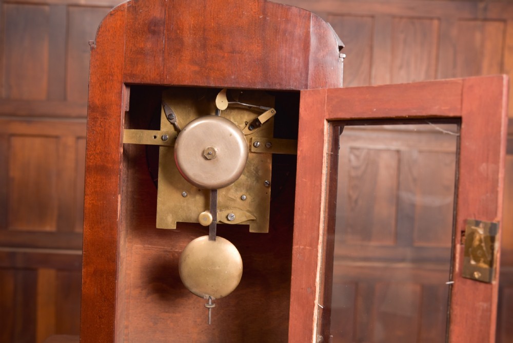 An antique mahogany bracket clock featuring Gothic spire finials, a carved foliage crest, and a cream dial signed Christie Perth set within a brass bezel. View XIII