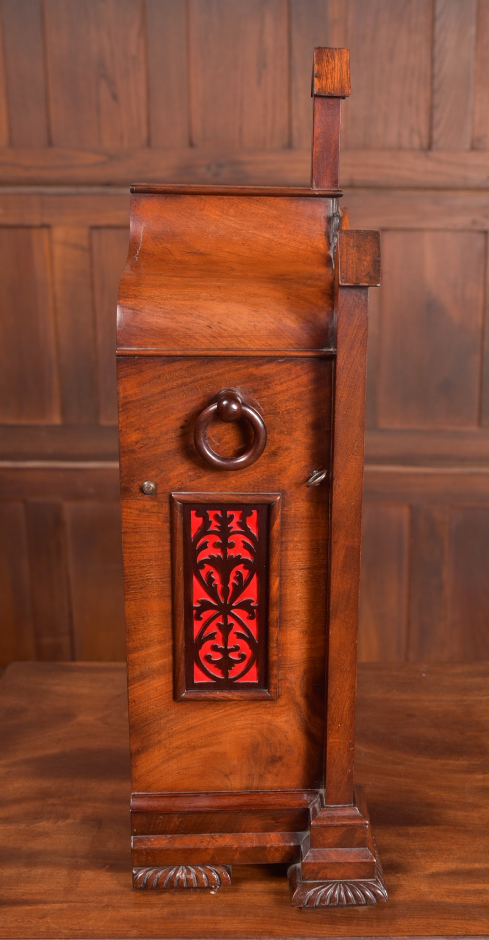 An antique mahogany bracket clock featuring Gothic spire finials, a carved foliage crest, and a cream dial signed Christie Perth set within a brass bezel. View XIV