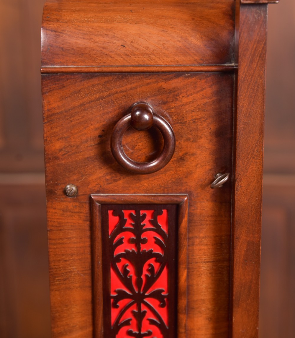 An antique mahogany bracket clock featuring Gothic spire finials, a carved foliage crest, and a cream dial signed Christie Perth set within a brass bezel. View XV