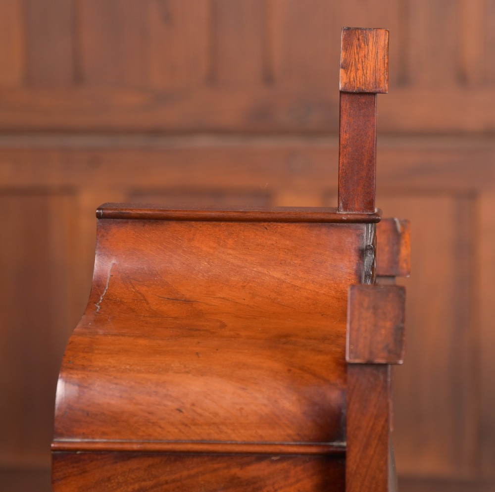 An antique mahogany bracket clock featuring Gothic spire finials, a carved foliage crest, and a cream dial signed Christie Perth set within a brass bezel. View XVI