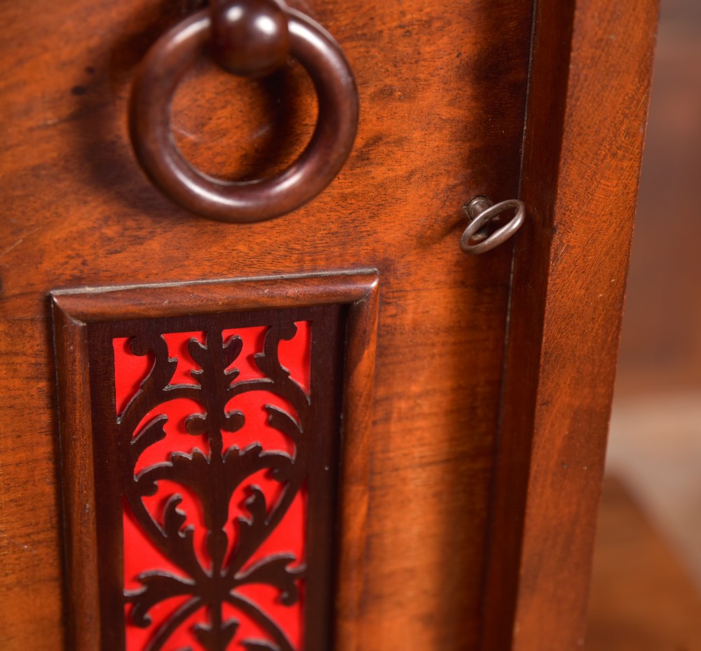 An antique mahogany bracket clock featuring Gothic spire finials, a carved foliage crest, and a cream dial signed Christie Perth set within a brass bezel. View XVII