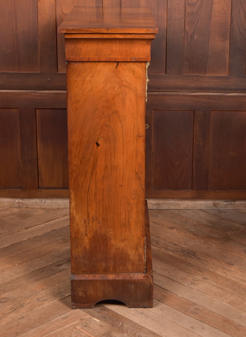 A Victorian walnut pier cabinet with a glazed single door, floral marquetry inlay, gilded ormolu mounts, and a red fabric-lined interior with shelves. View VI