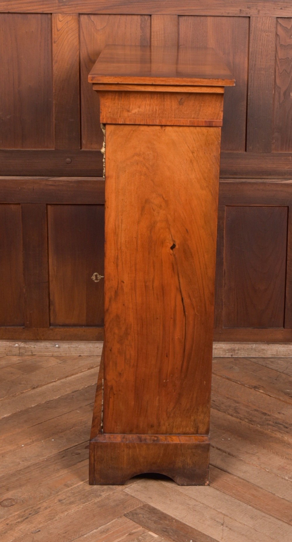 A Victorian walnut pier cabinet with a glazed single door, floral marquetry inlay, gilded ormolu mounts, and a red fabric-lined interior with shelves. View IX