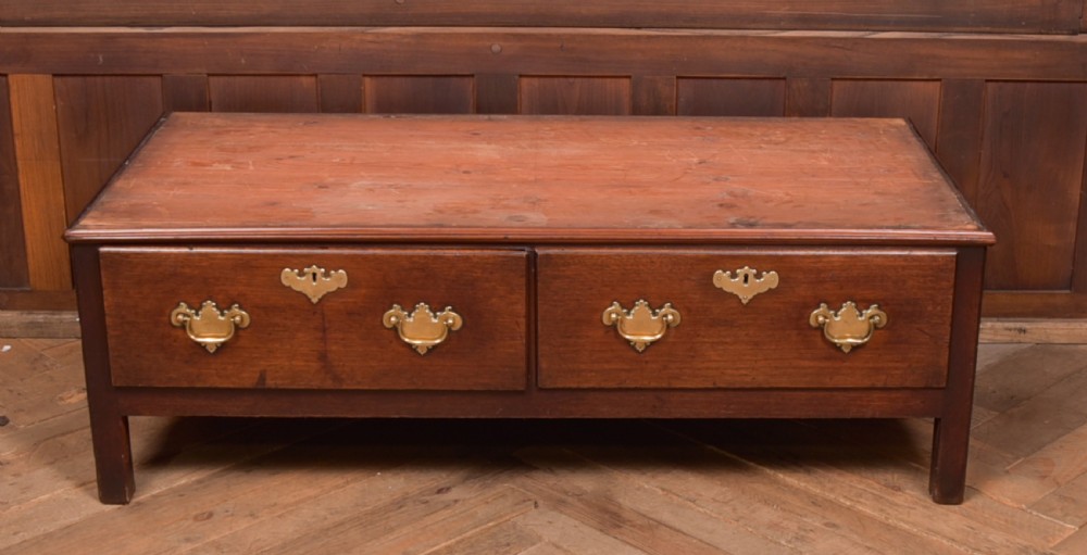 A Georgian mahogany mule chest featuring a hinged top lid above two lower drawers fitted with brass handles and keyhole escutcheons. View II