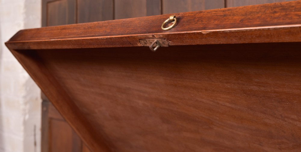A Georgian mahogany mule chest featuring a hinged top lid above two lower drawers fitted with brass handles and keyhole escutcheons. View X